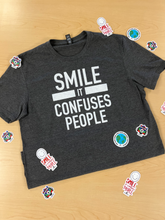Load image into Gallery viewer, &quot;SMILE IT CONFUSES PEOPLE&quot; T-shirt - Gray
