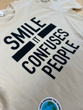Load image into Gallery viewer, &quot;SMILE IT CONFUSES PEOPLE&quot; T-Shirt - Cream
